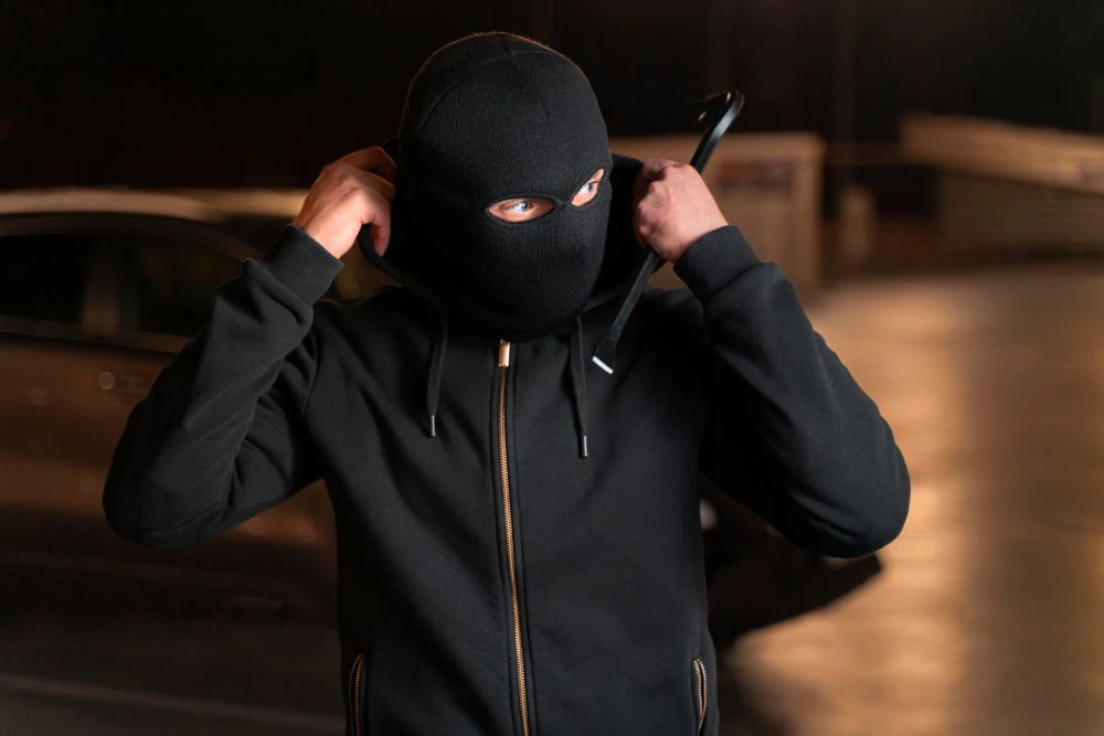 close up man trying break into car
