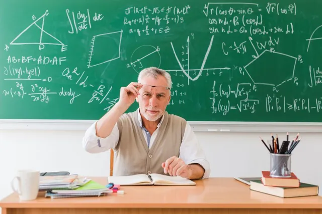 smiling old professor maths classroom