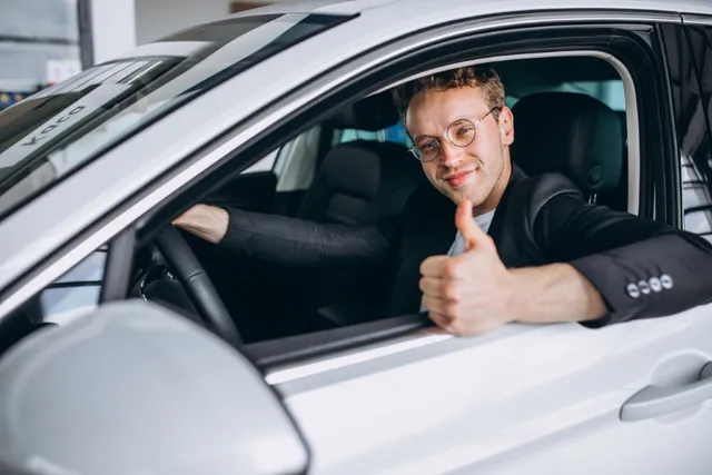 handsome man sitting car